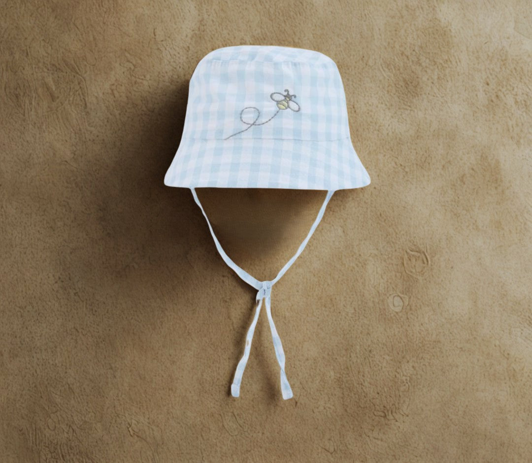 Cappello neonato a quadri blu e bianco